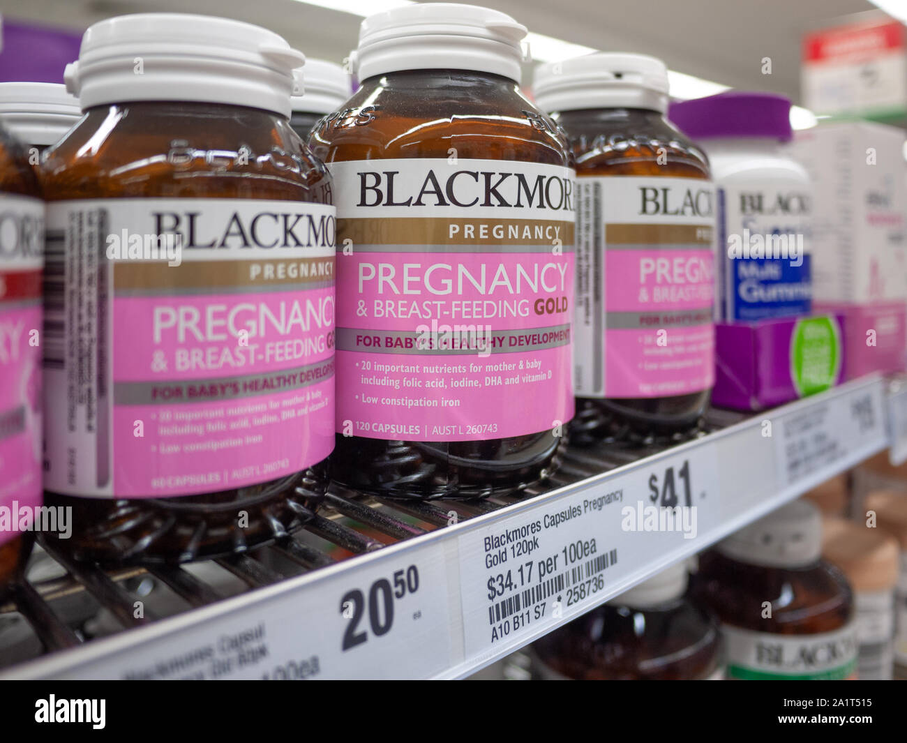Blackmores pregnancy & breastfeeding gold vitamin capsules placed on a supermarket shelf. Melbourne, VIC Australia Stock Photo