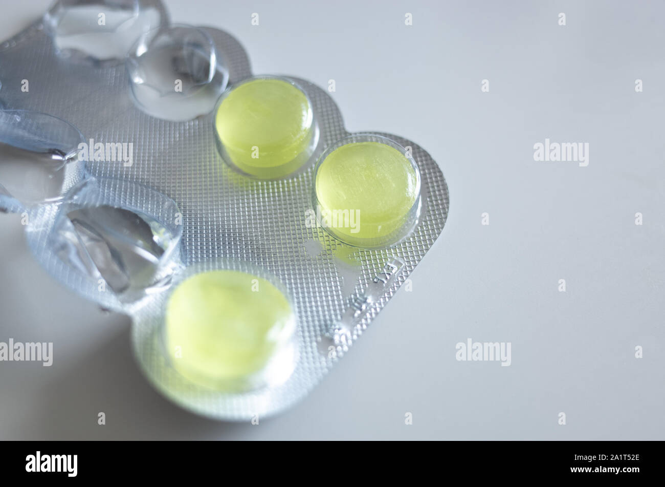 Close up of some medicine tablets/throat lozenges in a blister pack. Copy space for text. Stock Photo