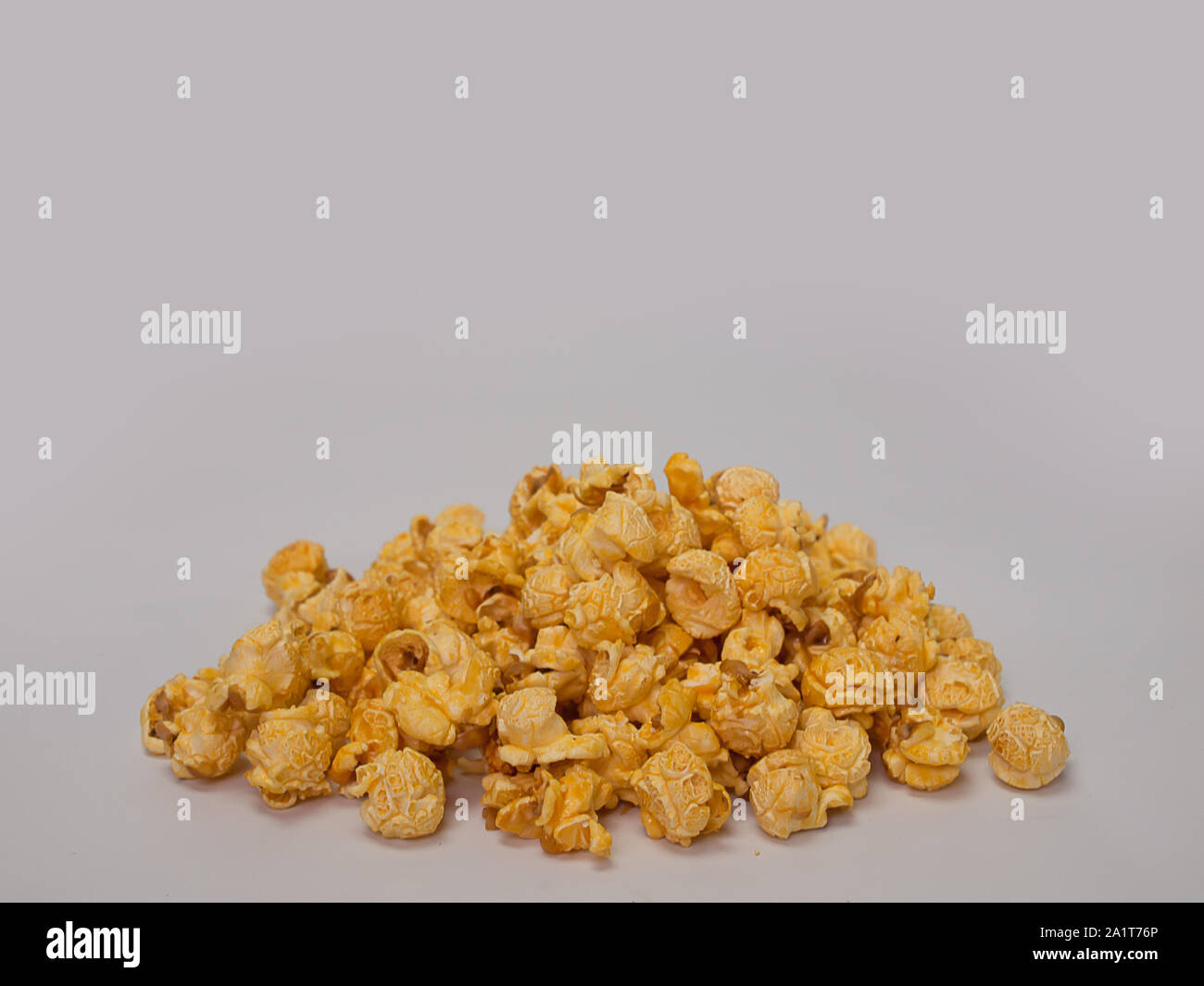 sweet caramel popcorn ,Placed on a white background. Stock Photo