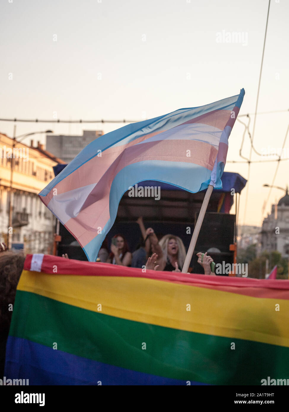 BELGRADE, SERBIA - SEPTEMBER 15, 2019:  Transgender pride flag waiving with the rainbow flag during the Belgrade Gat PrudeThe parade happened this yea Stock Photo