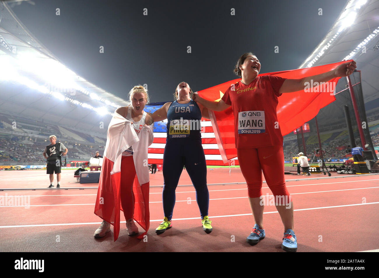 Duoha, Qatar. 28th Sep, 2019. Bronze medalist China's Wang Zheng (R) celebrates with gold medalist DeAnna Price (C) of the United States and silver medalist Joanna Fiodorow of Poland after the women's hammer throw final at the 2019 IAAF World Athletics Championships in Doha, Qatar, Sept. 28, 2019. Credit: Li Ming/Xinhua/Alamy Live News Stock Photo