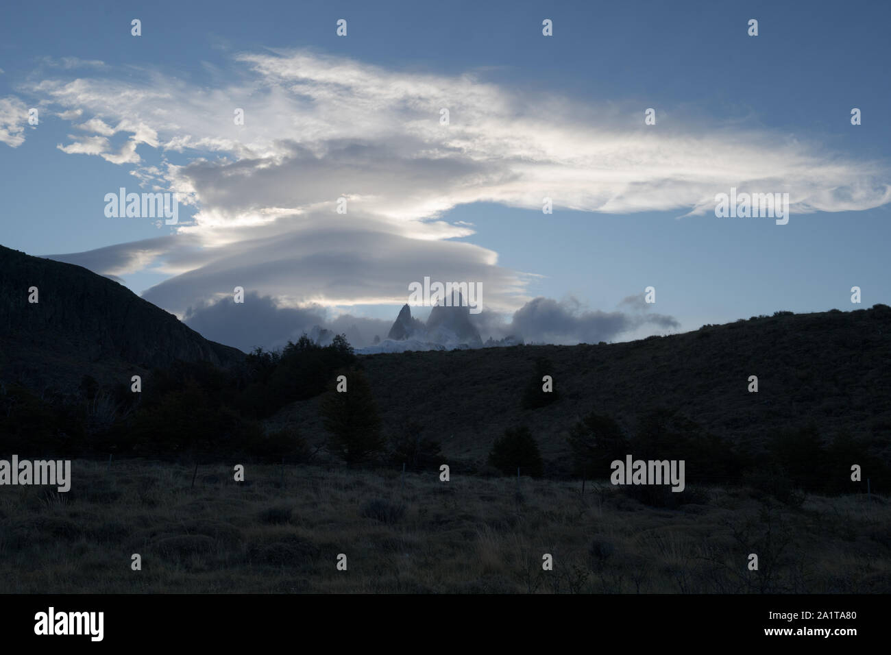 View of Mount FitzRoy with lenticular clouds above during early sunset.ii Stock Photo