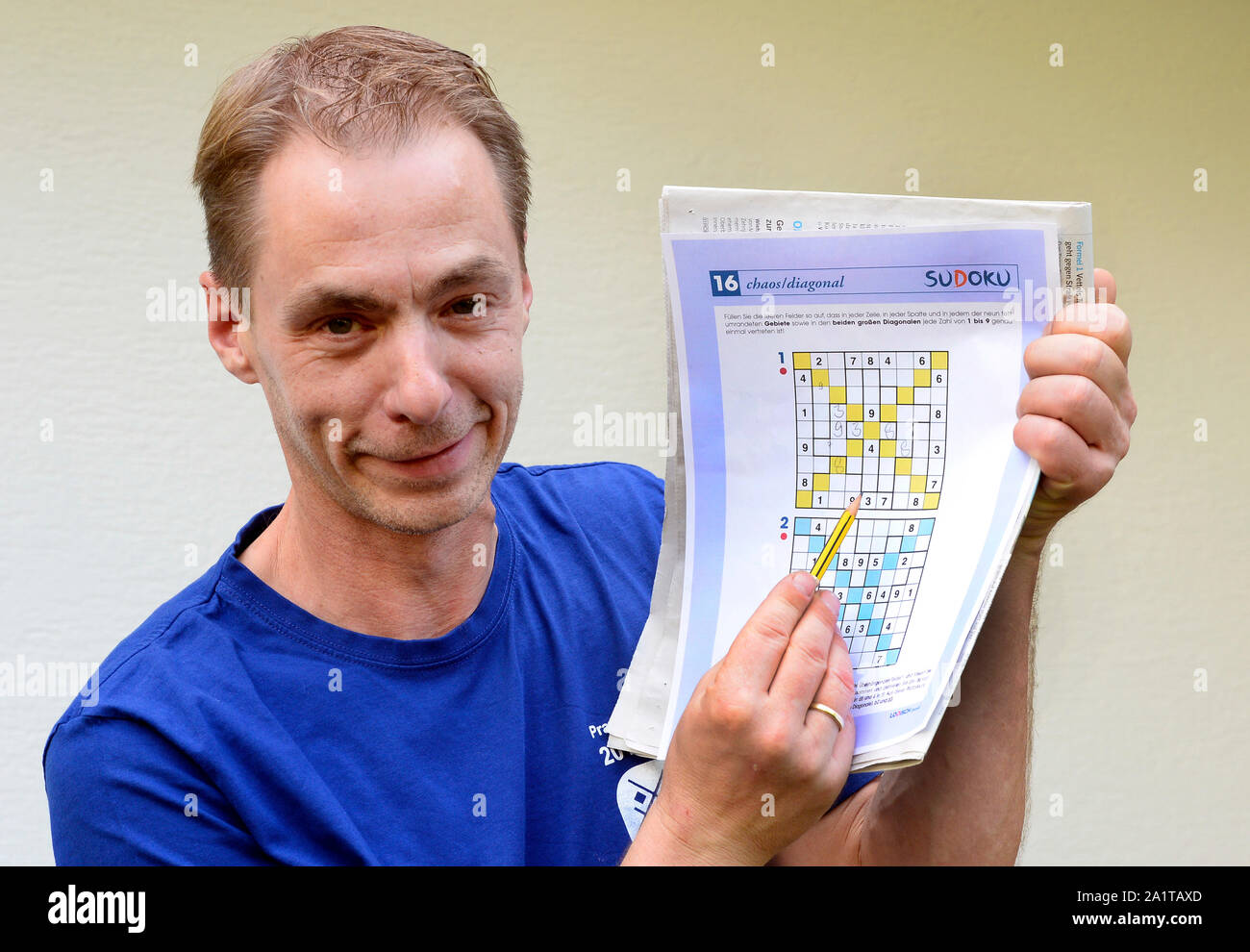 Engelskirchen, Germany. 27th Sep, 2019. Postman Michael Ley points to a  Sudoku number puzzle. The postman from the Bergisches Land has prospects  for the title Sudoku World Champion. He is multiple German