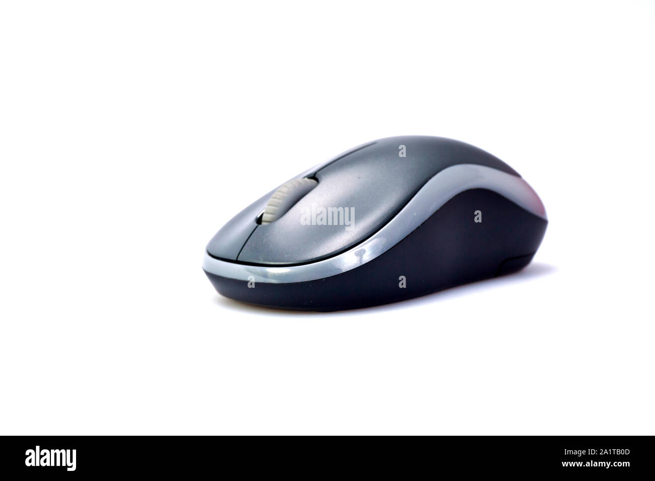 Grey wireless mouse on white surface Stock Photo