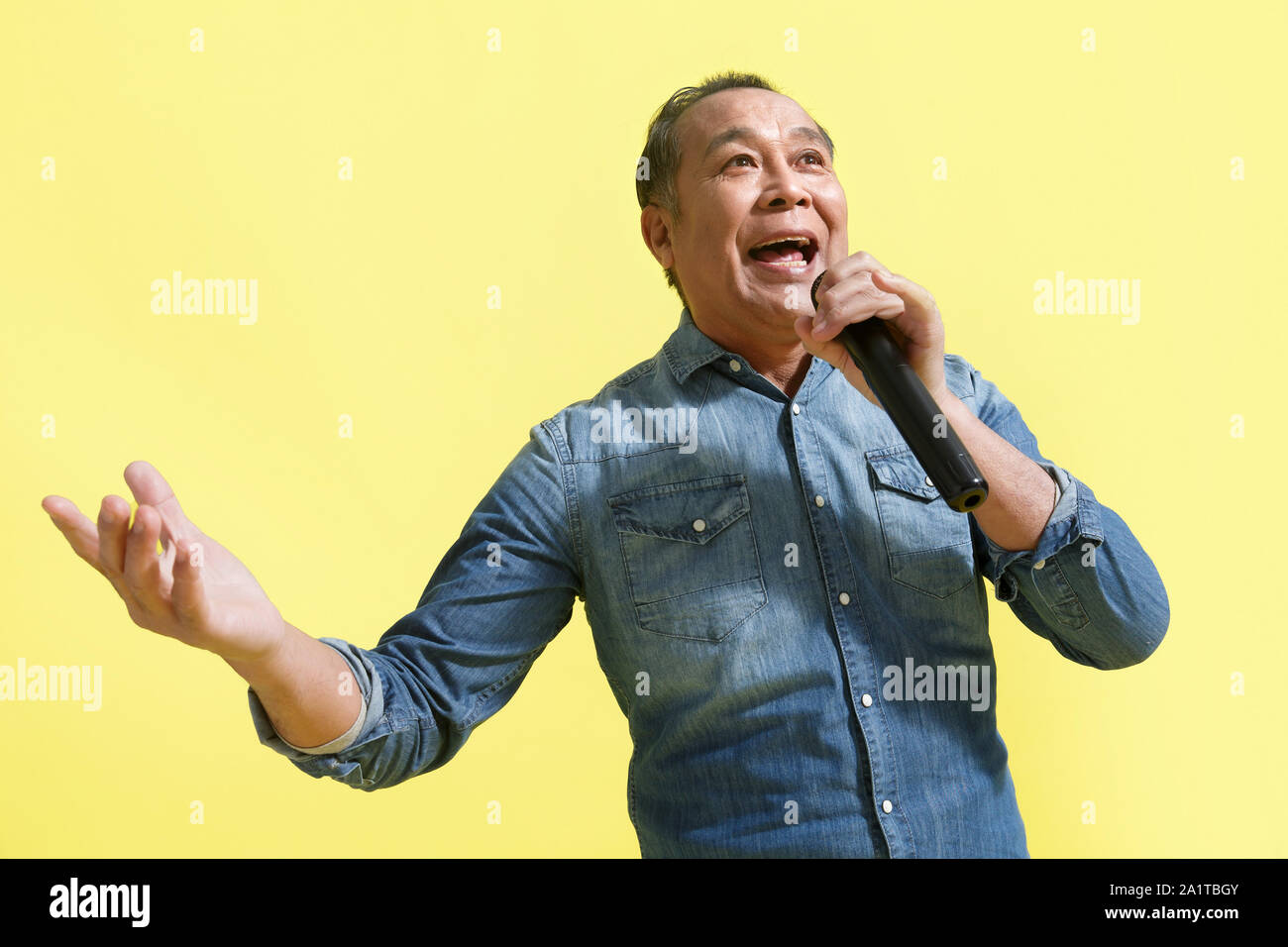 Happy old man singing Stock Photo