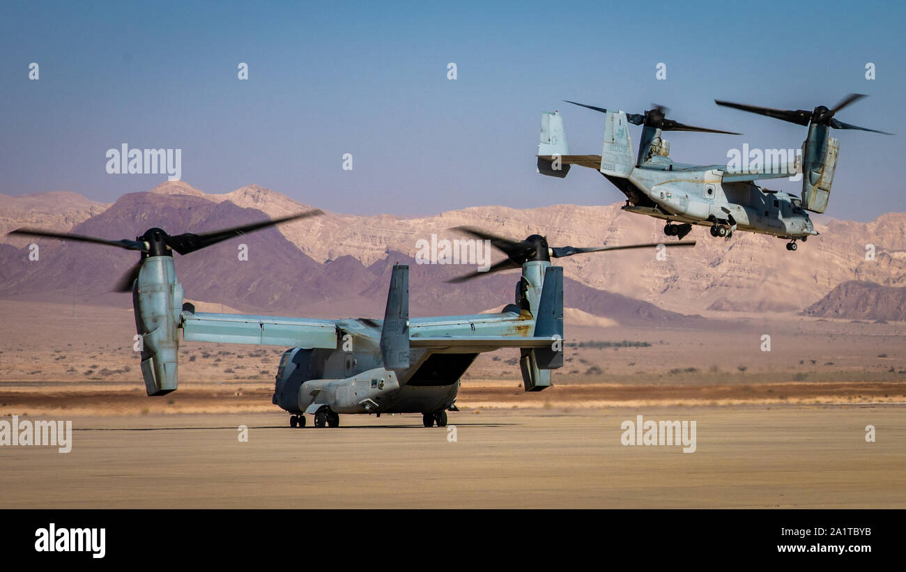 U.S. Marines with Marine Medium Tiltrotor Squadron (VMM) 364, attached to Special Purpose Marine Air-Ground Task Force-Crisis Response-Central Command, prepare MV-22 Ospreys for flight operations during a simulated air-raid as part of the Middle East Amphibious Commanders Symposium, Sept. 24, 2019. The SPMAGTF-CR-CC is a multiple force provider designed to employ ground, logistics, and air capabilities throughout the Central Command area of responsibility. (U.S. Marine Corps photo by Sgt. Branden Bourque) Stock Photo