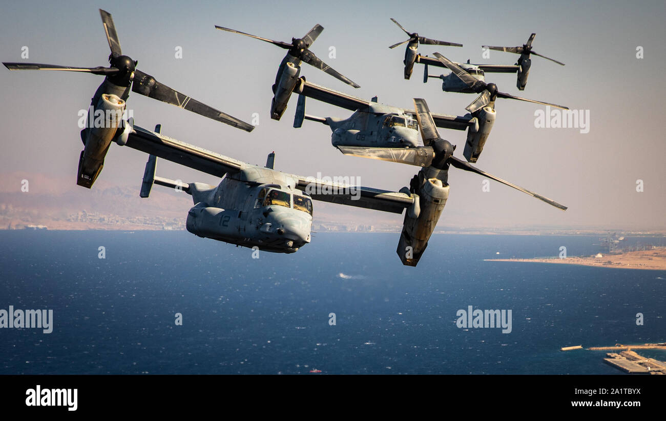 U.S. Marines with Marine Medium Tiltrotor Squadron (VMM) 364, attached to Special Purpose Marine Air-Ground Task Force-Crisis Response-Central Command, fly multiple MV-22 Ospreys during a simulated air-raid as part of the Middle East Amphibious Commanders Symposium, Sept. 24, 2019. The SPMAGTF-CR-CC is a multiple force provider designed to employ ground, logistics, and air capabilities throughout the Central Command area of responsibility. (U.S. Marine Corps photo by Sgt. Branden Bourque) Stock Photo