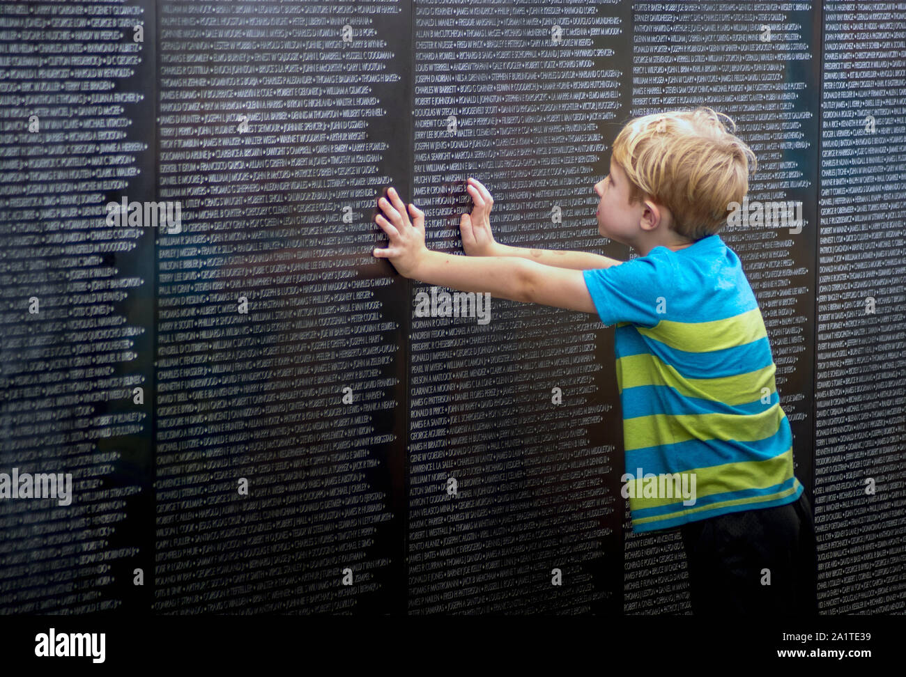 South Bend Indiana USA, September 21 2019; A young boy learns about the traveling Vietnam memorial wall, and what all the names on this wall represent Stock Photo