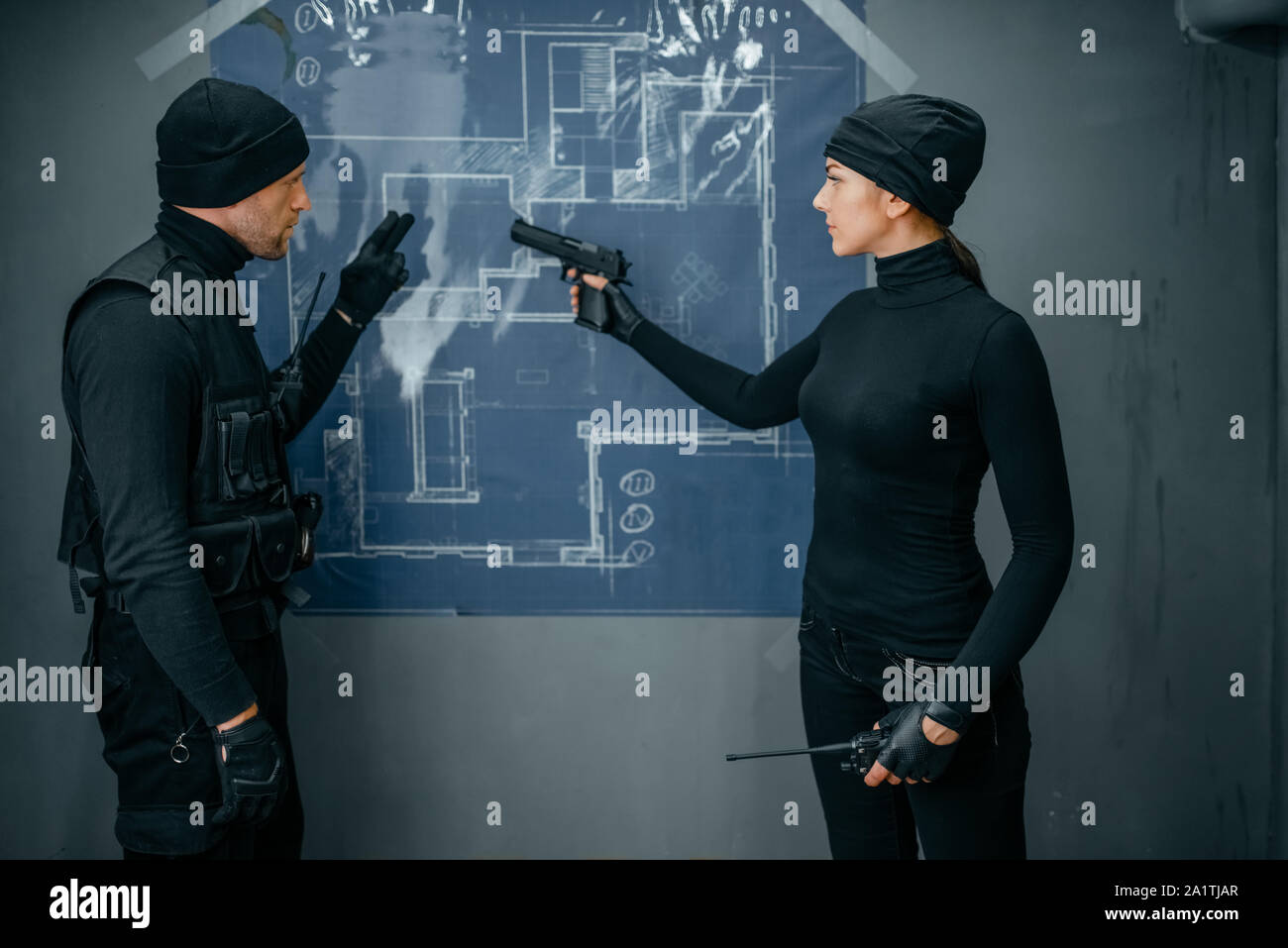 Two robbers working on a plan to rob the vault Stock Photo