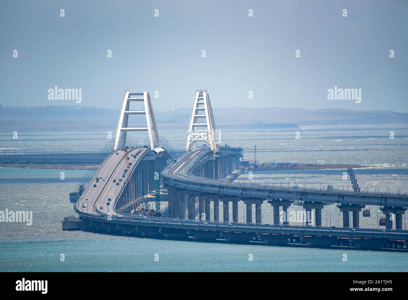 Distant view Crimean automobile bridge connecting the banks of the Kerch Strait: Taman and Kerch. Sunny summer day Stock Photo
