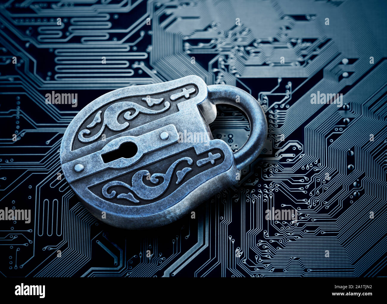 Computer security concept. Old mysterious padlock on computer circuit ...