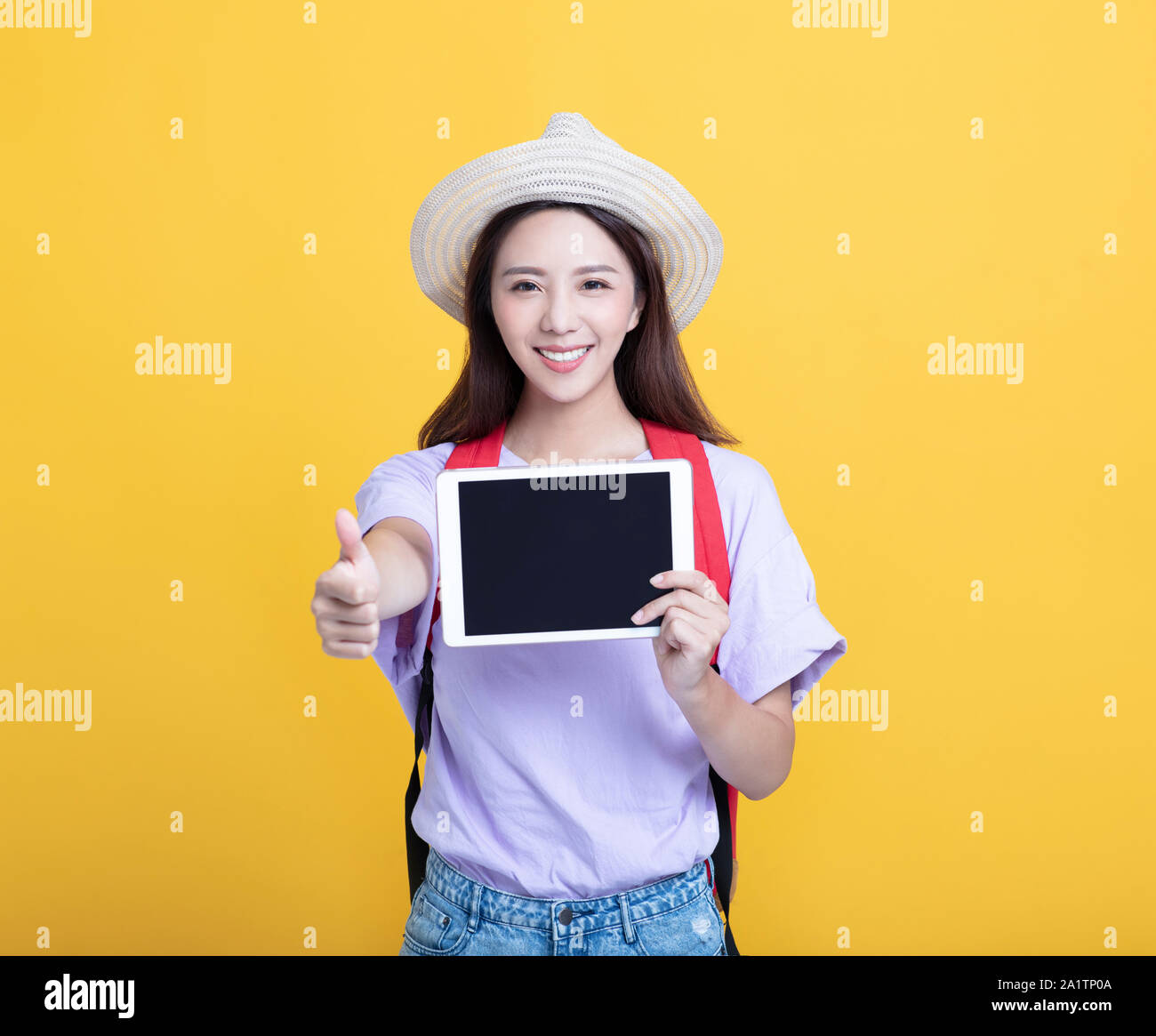student girl showing tablet computer and thumbs up Stock Photo - Alamy