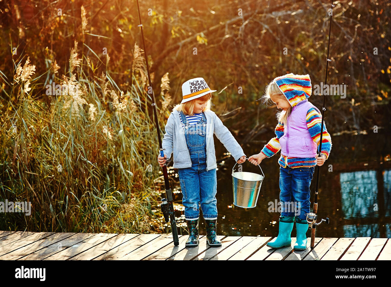 Two little girls fishing hi-res stock photography and images - Alamy