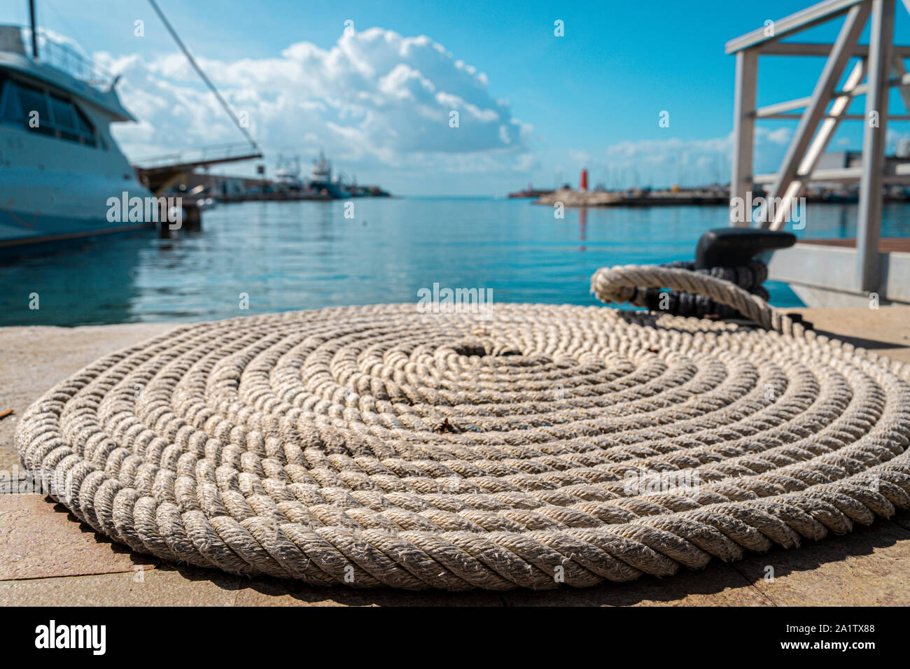 Strong fishermen ropes rolled in a circle Stock Photo - Alamy