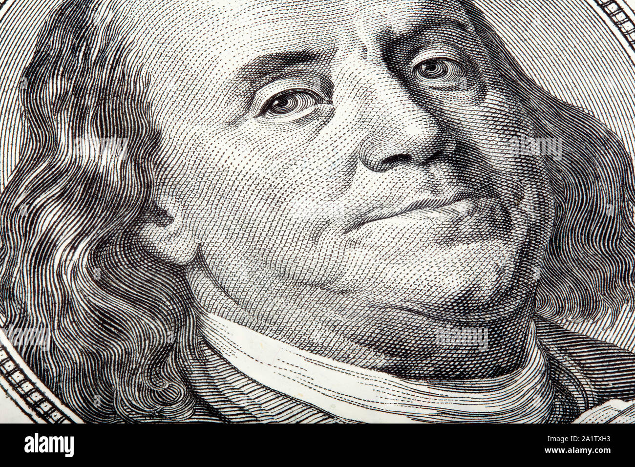 Benjamin looking at you on money, stacked macro photo. Stock Photo