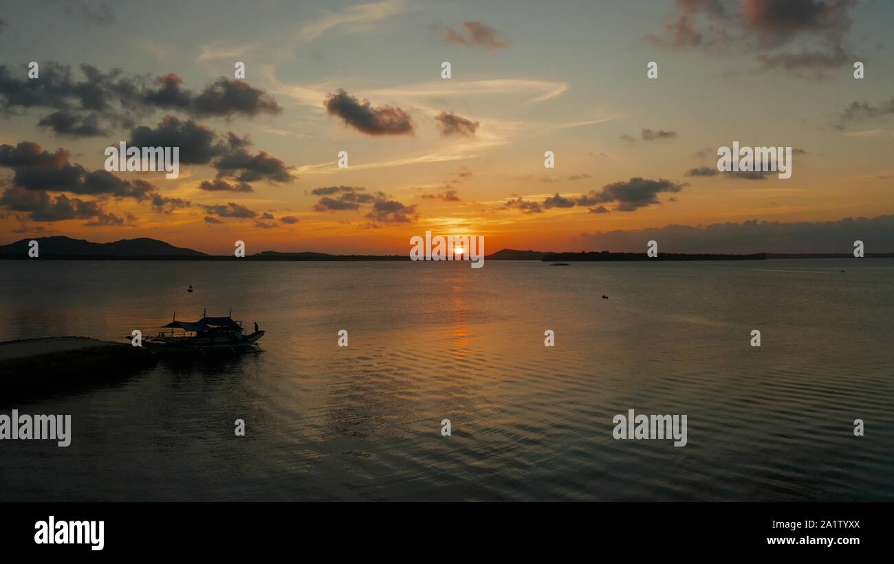 Sun sunset reflected on sea hi-res stock photography and images - Alamy