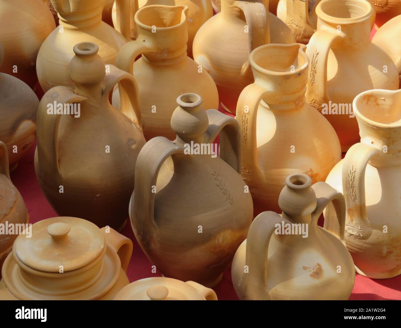 Beautiful kitchen utensils made of clay by hand by expert hands Stock Photo  - Alamy