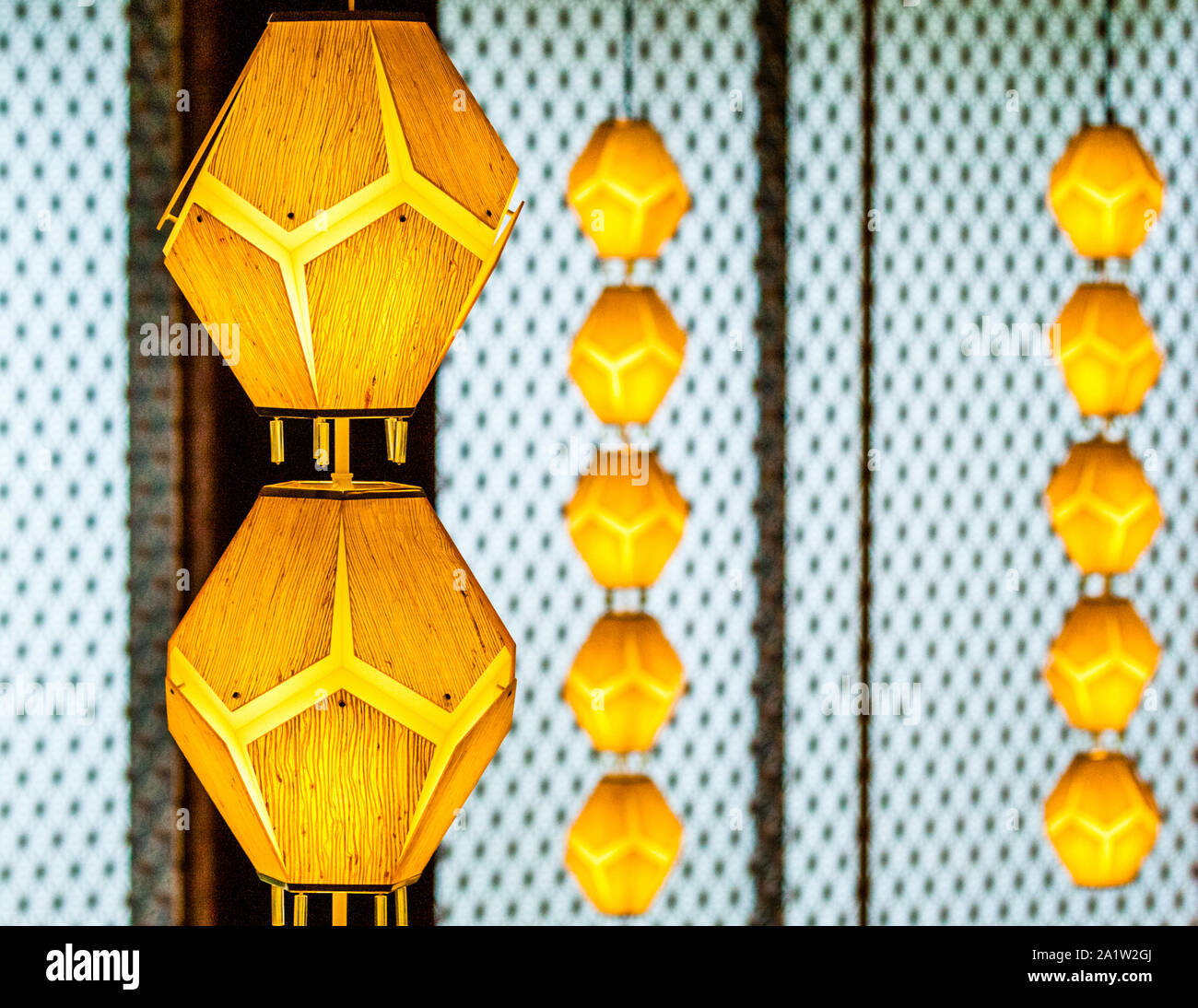 Ceiling lamps in the Okuro Hotel Tokyo. Preserved from the old Okura Hotel: The pentagonal covering of the famous lights Stock Photo
