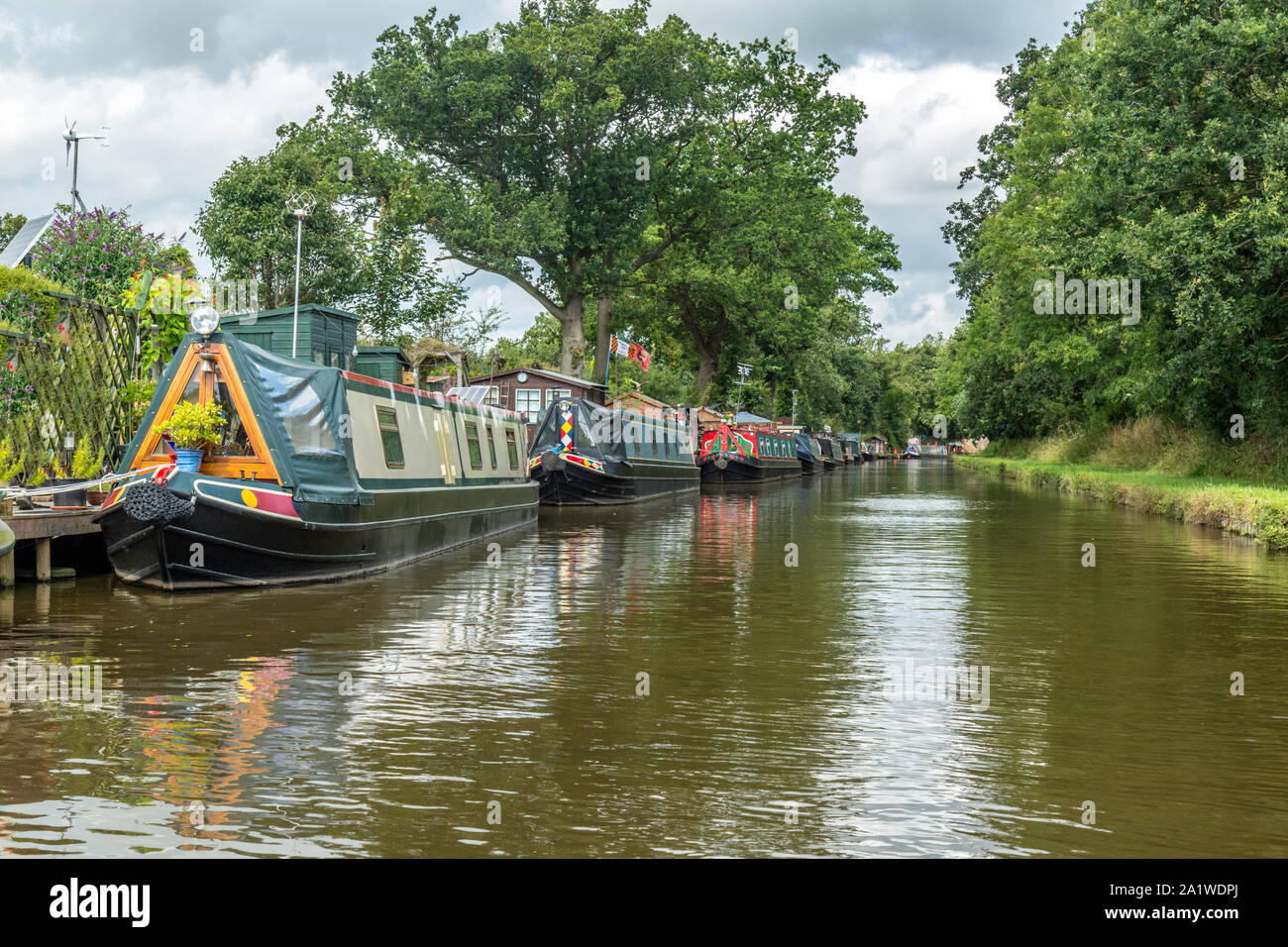 Narrow Boats, or Barges, moored up on The Shropshire Union Canal in England. Stock Photo