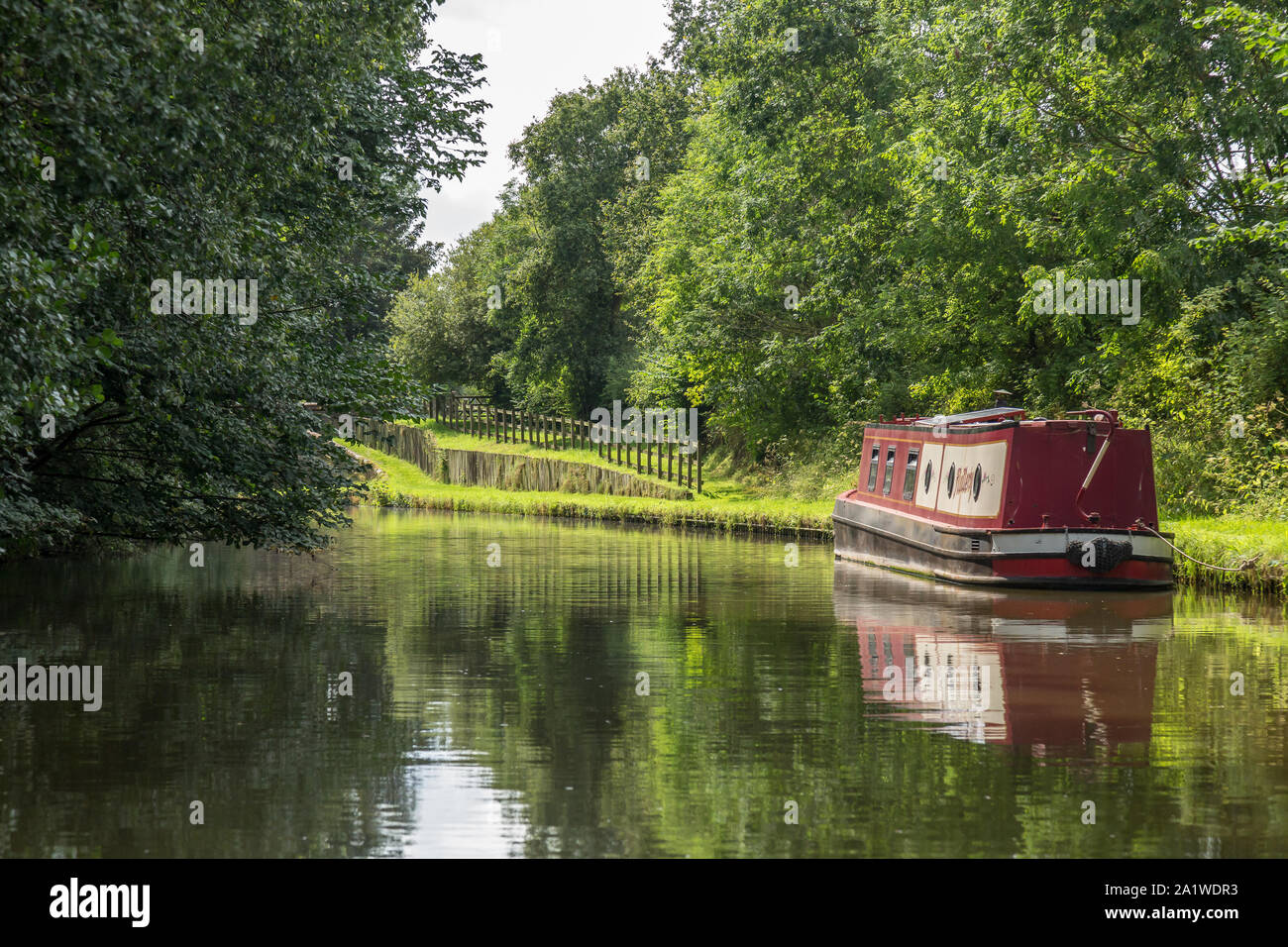 A Narrow Boat, or Barge, moored up on The Shropshire Union Canal in England. Stock Photo