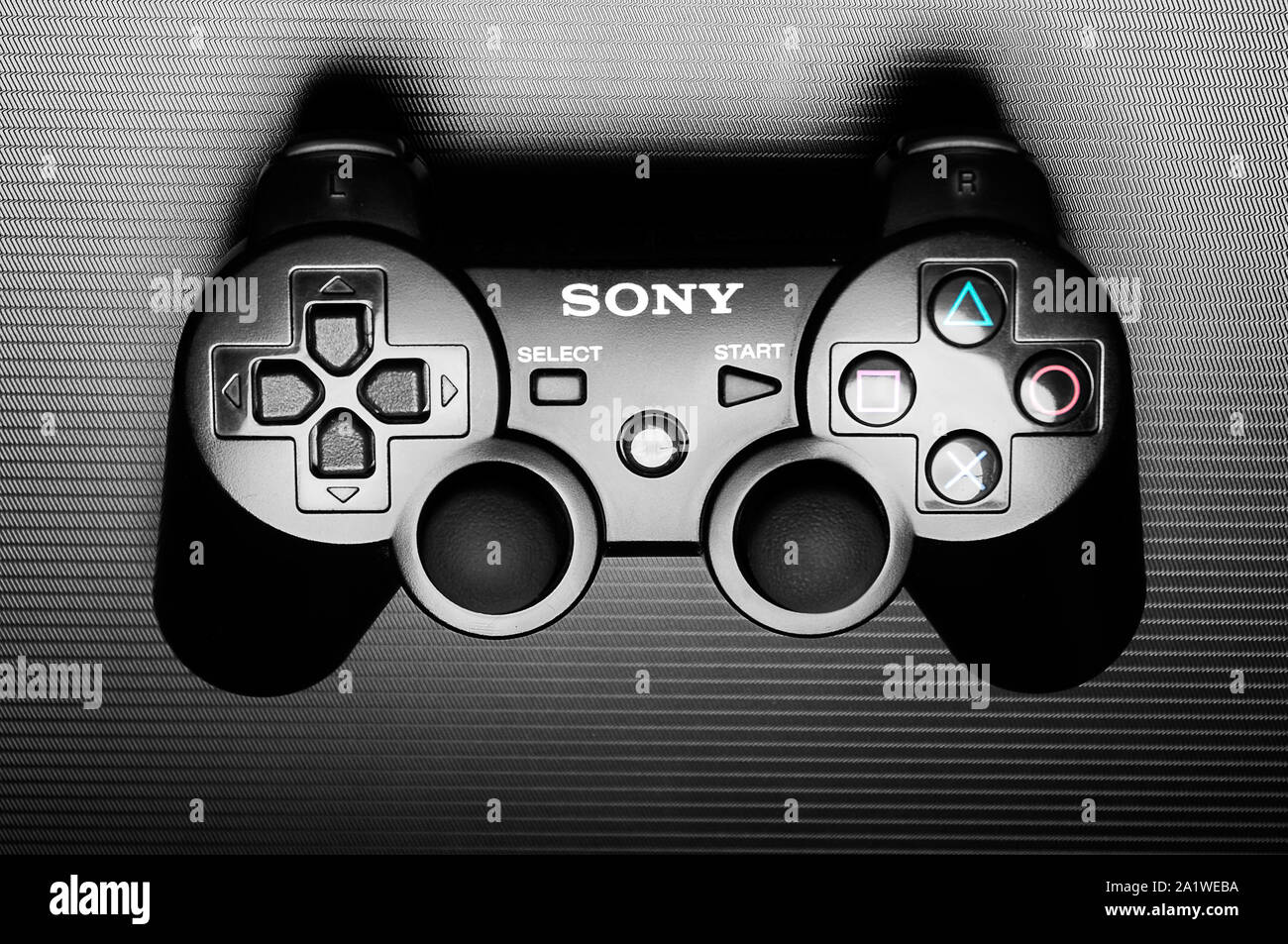 DualShock 3 wireless controller, a gamepad for the PlayStation 3, a home  video game console produced by Sony Computer Entertainment, on dark  backgroun Stock Photo - Alamy