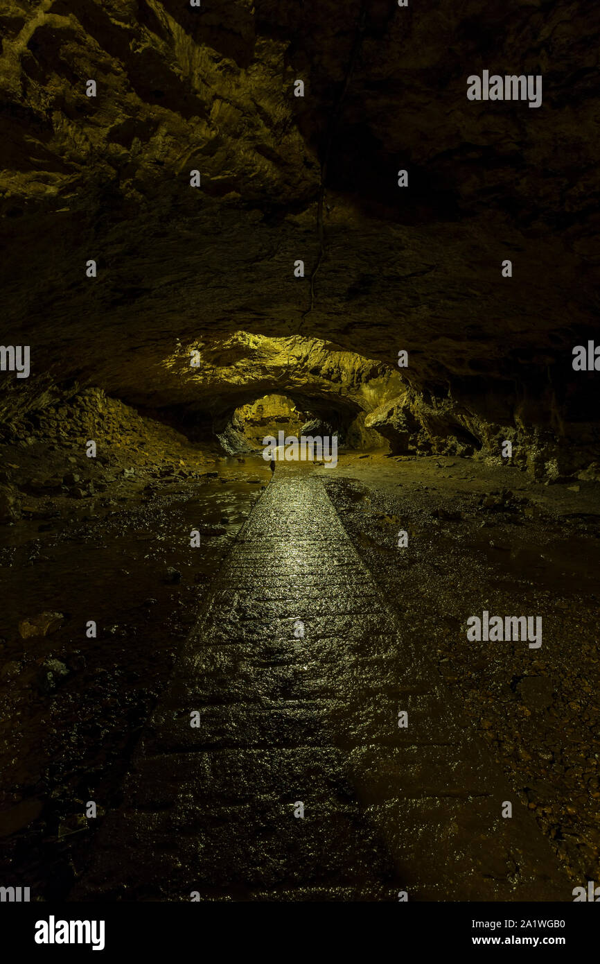 A Walking Path Inside Of A Cave Stock Photo
