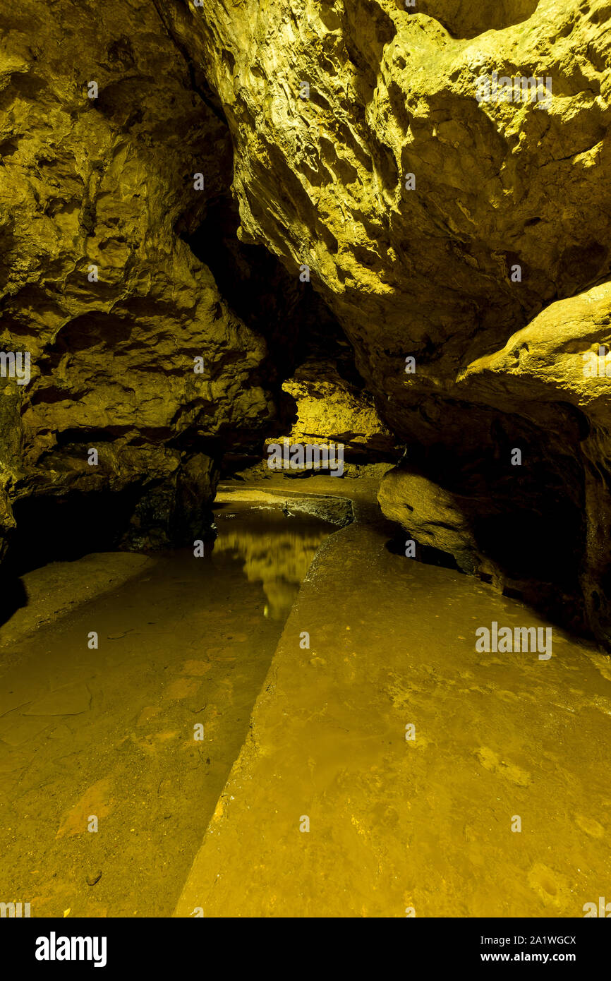 A Walking Path Inside Of A Cave Stock Photo