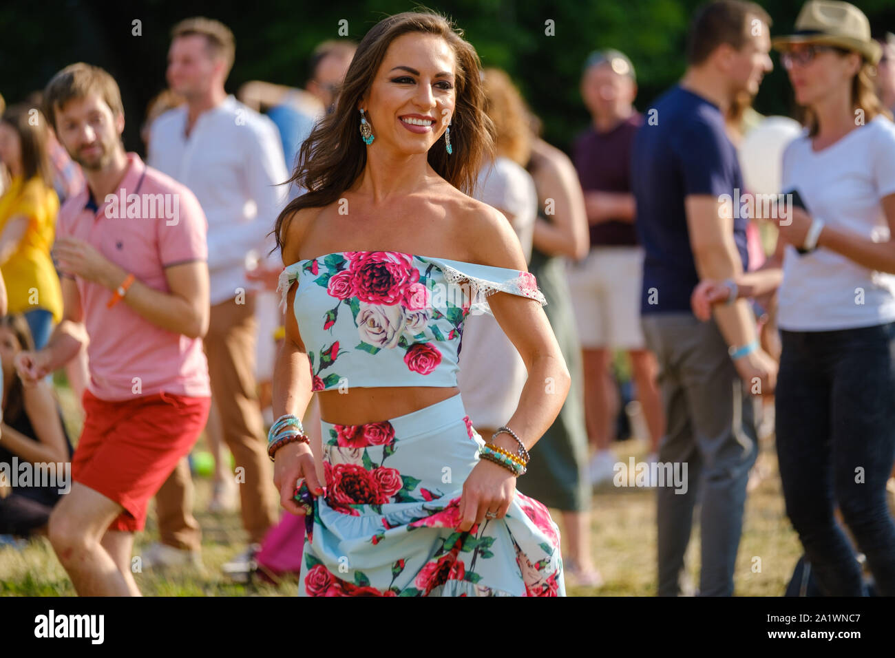 Young woman dancing at open air music festival Stock Photo - Alamy