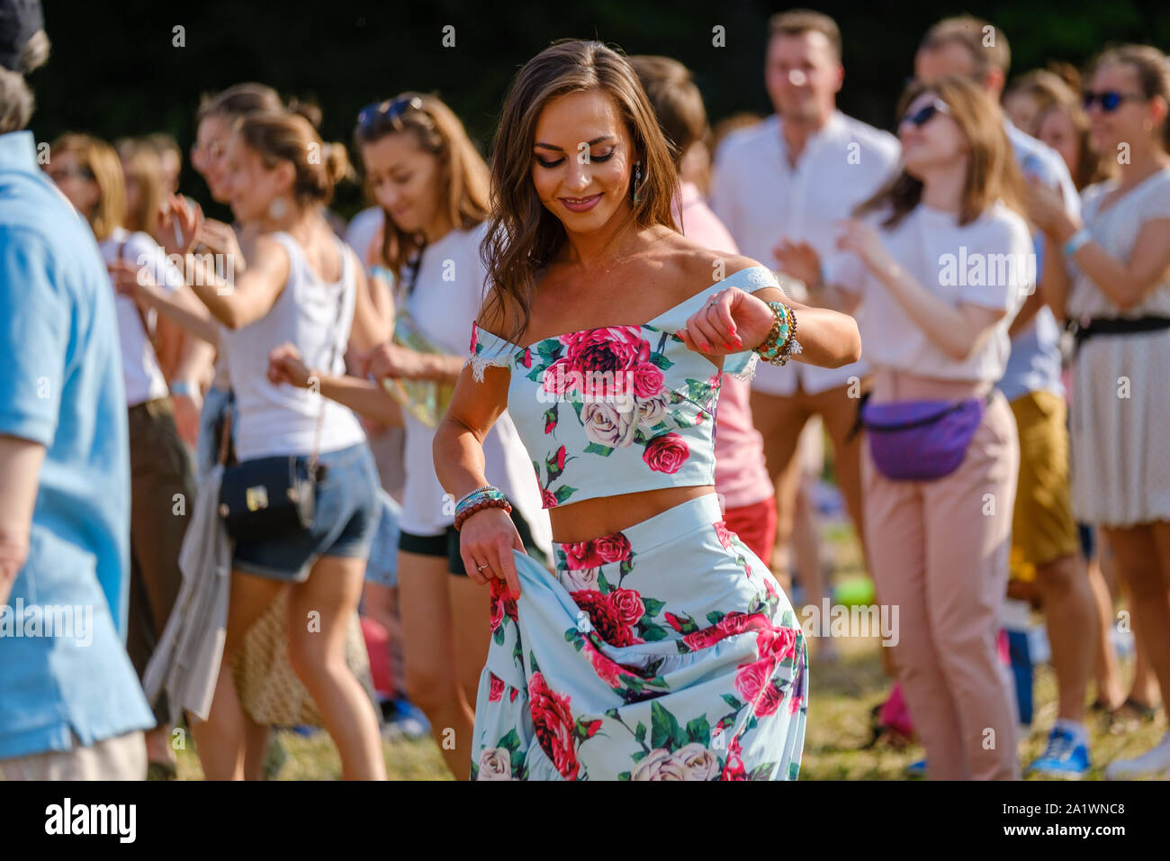 Young woman dancing at open air music festival Stock Photo - Alamy