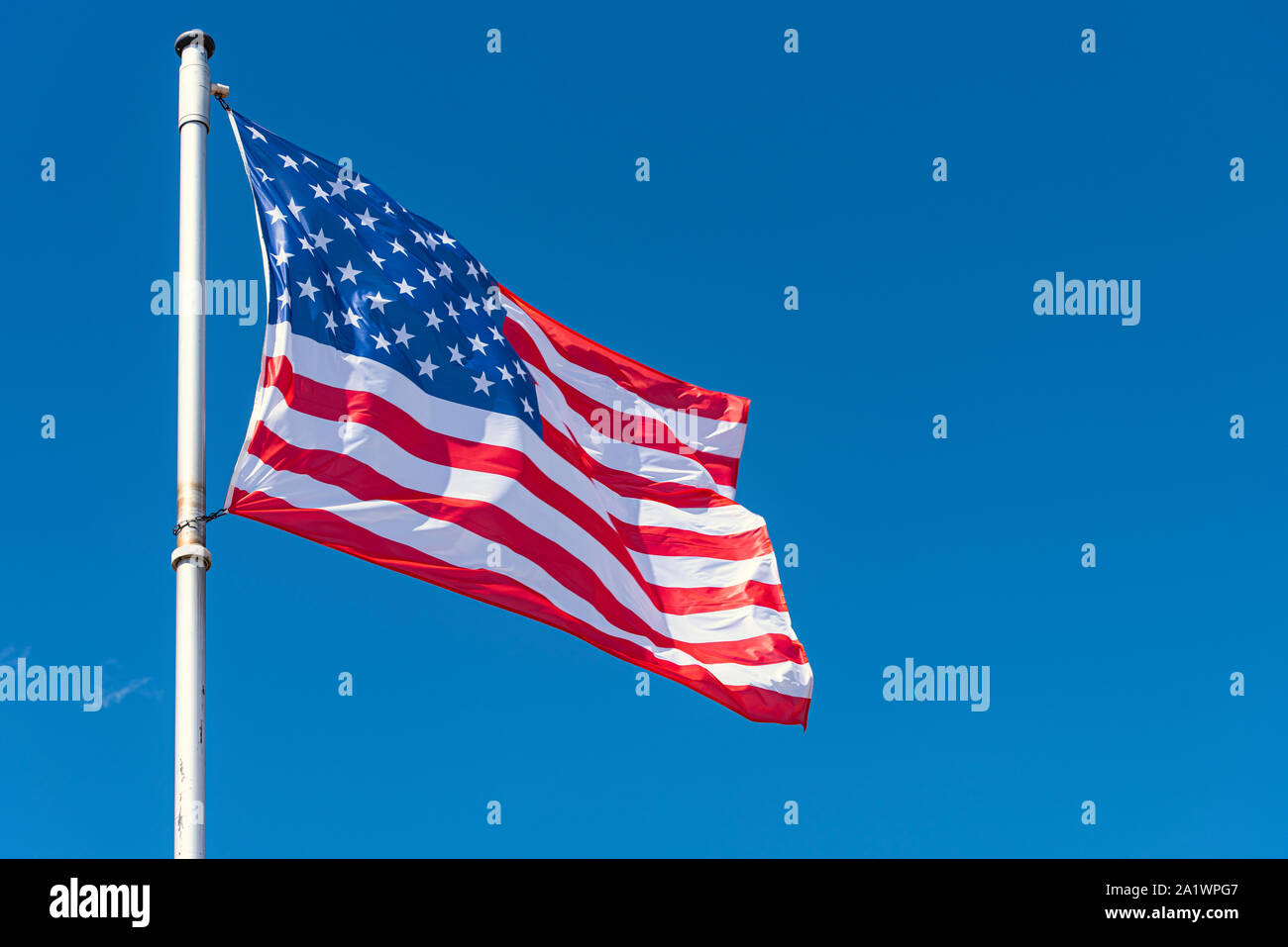 USA Flag and blue Sky as Background, American Flag waving on flagpole, New York Stock Photo Alamy