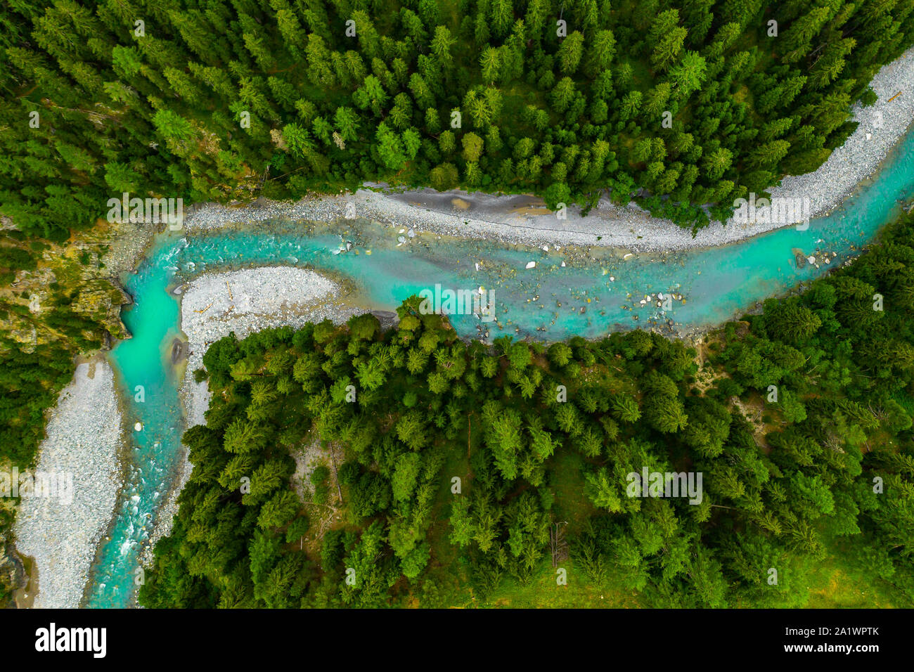 Inn River flowing in the forest in Switzerland. Aerial view from drone on a  blue river in the mountains Stock Photo - Alamy