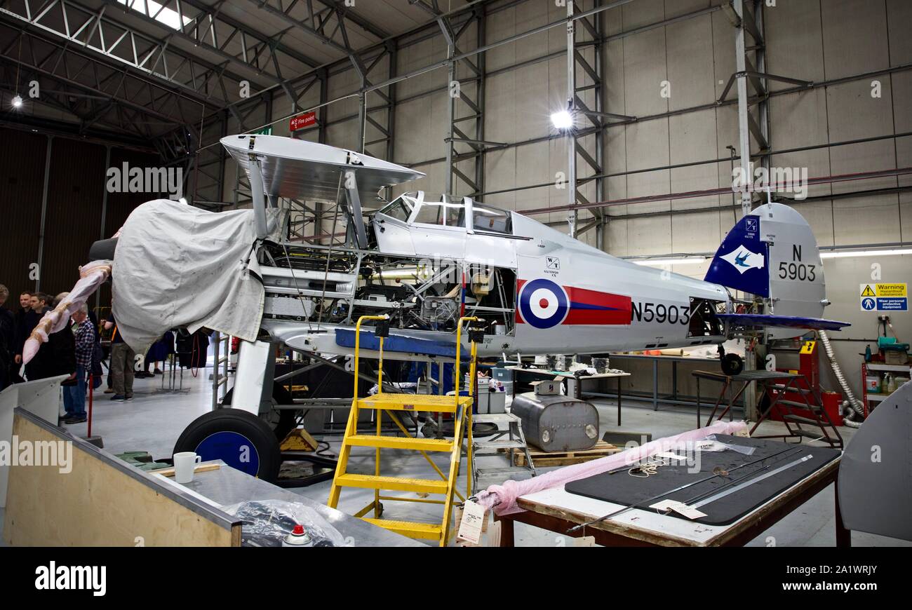 The Fighter Collection Gloster Gladiator (G-GLAD) under  going maintenance at the IWM Duxford Stock Photo