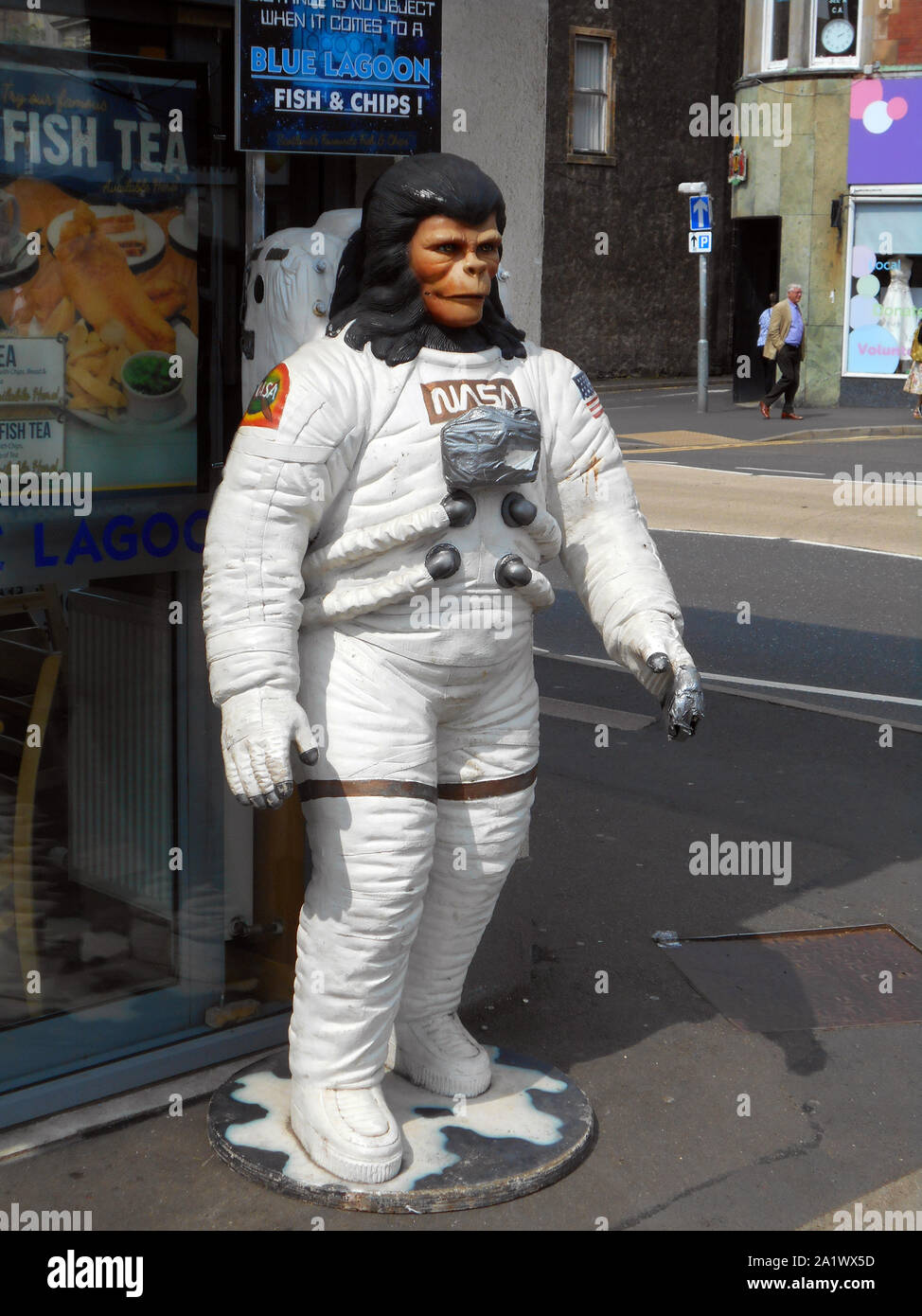 This strange sight of a 'Planet of the Apes' cast member, in a space suit, can be seen outside a fish and chip restaurant in the sea side, holiday town of Largs, on the west coast of Scotland. Alan Wylie/ALAMY © Stock Photo