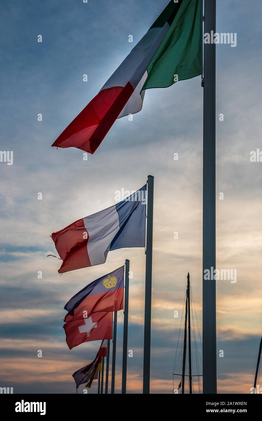 Flags of different countries and a golden sunset Stock Photo