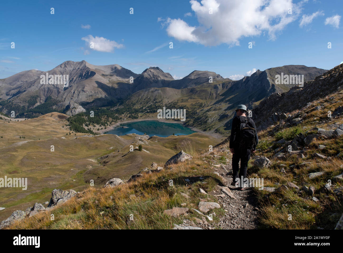 A man hiking in the mountains in the Alps in France Stock Photo