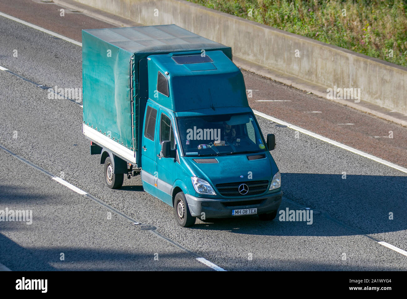 Old Vintage Mercedes-Benz camper conversion; UK Vehicular traffic, transport, modified vehicle south-bound on the 3 lane M6 motorway highway. Stock Photo