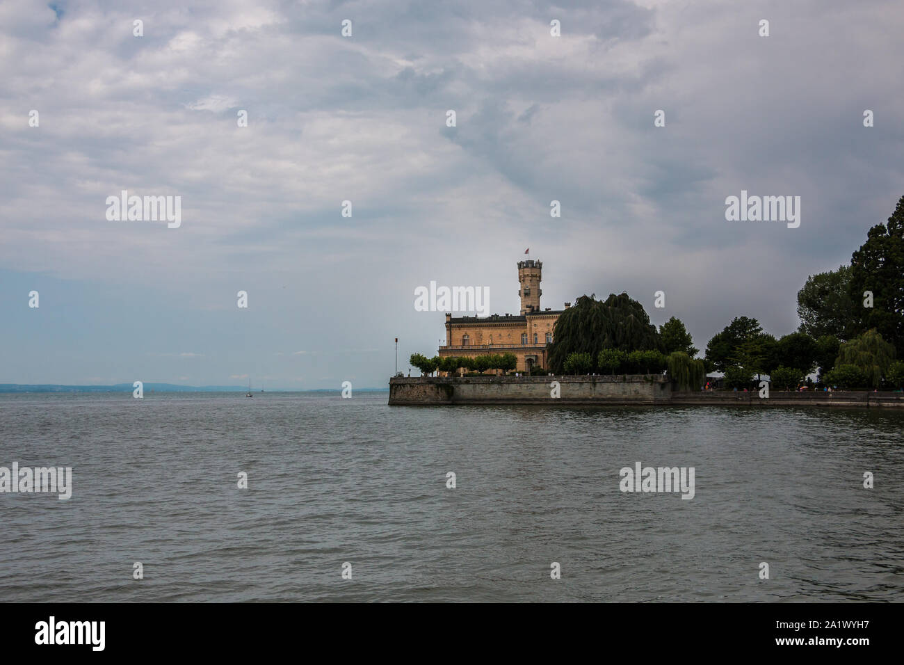 Little castle with round tower near the lake Stock Photo