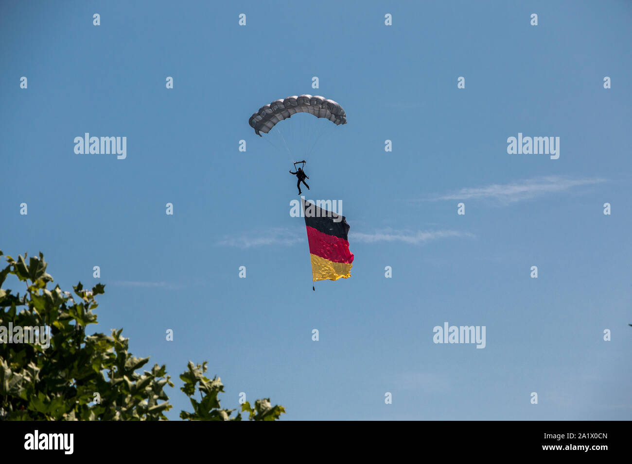 German skydiver in the air with German flag Stock Photo