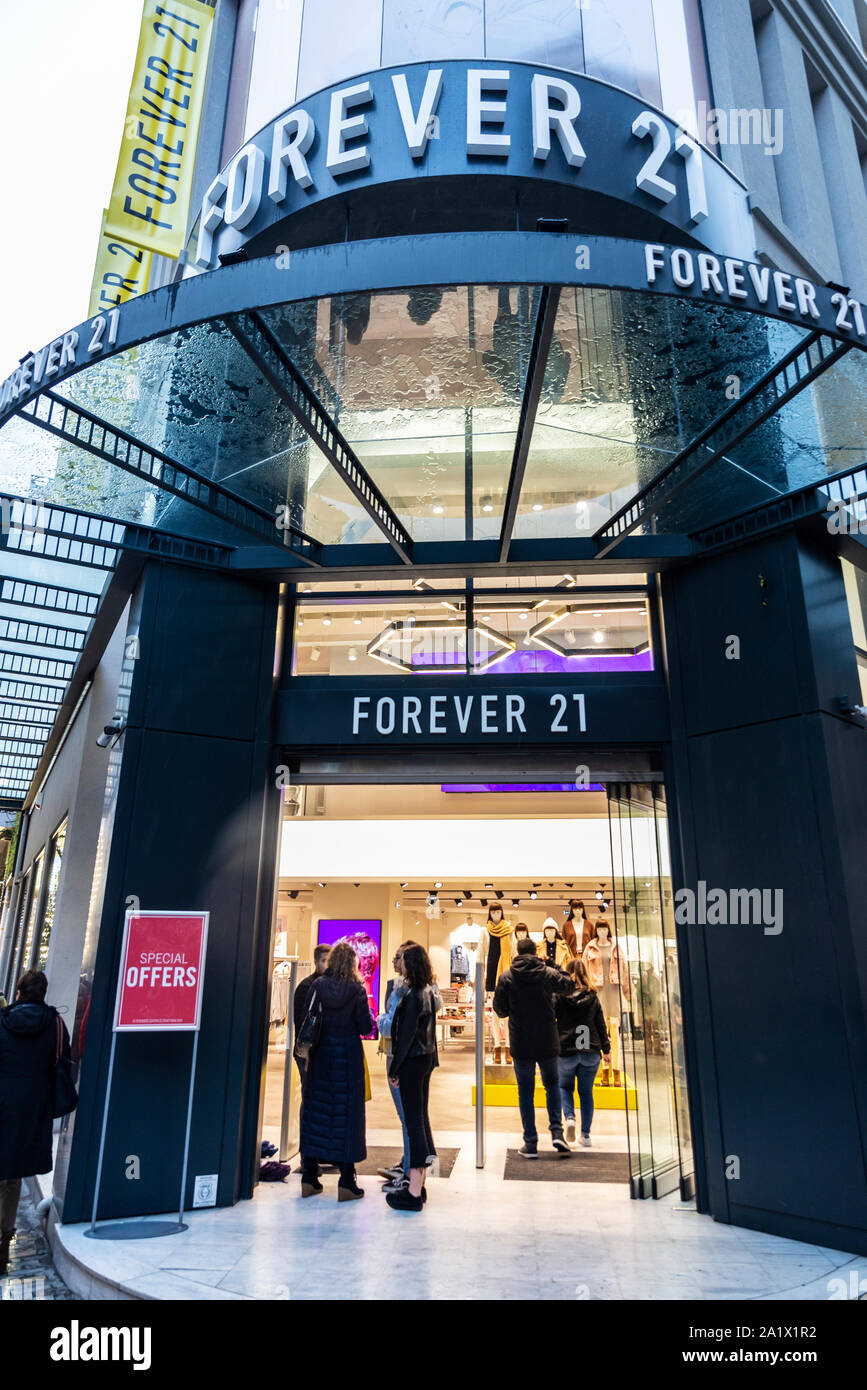 Exterior Facade Of Forever 21 On 14th Street Manhattan New York City  African American Woman Pushing A Stroller Walks Passed Forever 21  Storefront Busy New York Street Stock Photo - Download Image Now - iStock