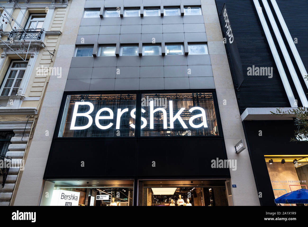 Athens, Greece - January 4, 2019: Display of a Bershka store at night in Athens, Greece Stock Photo