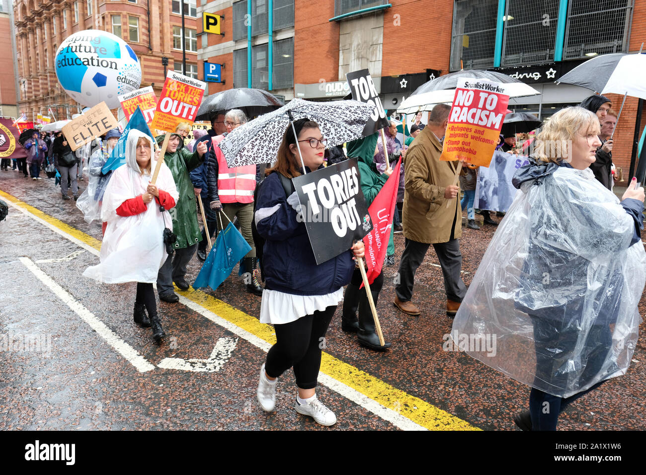 Manchester, UK – Sunday 29th September 2019.  Protesters demonstrate in the rain against Austerity and Brexit in Manchester city centre near the Conservative Party Conference on the opening day of the Tory event.  Photo Steven May / Alamy Live News Stock Photo