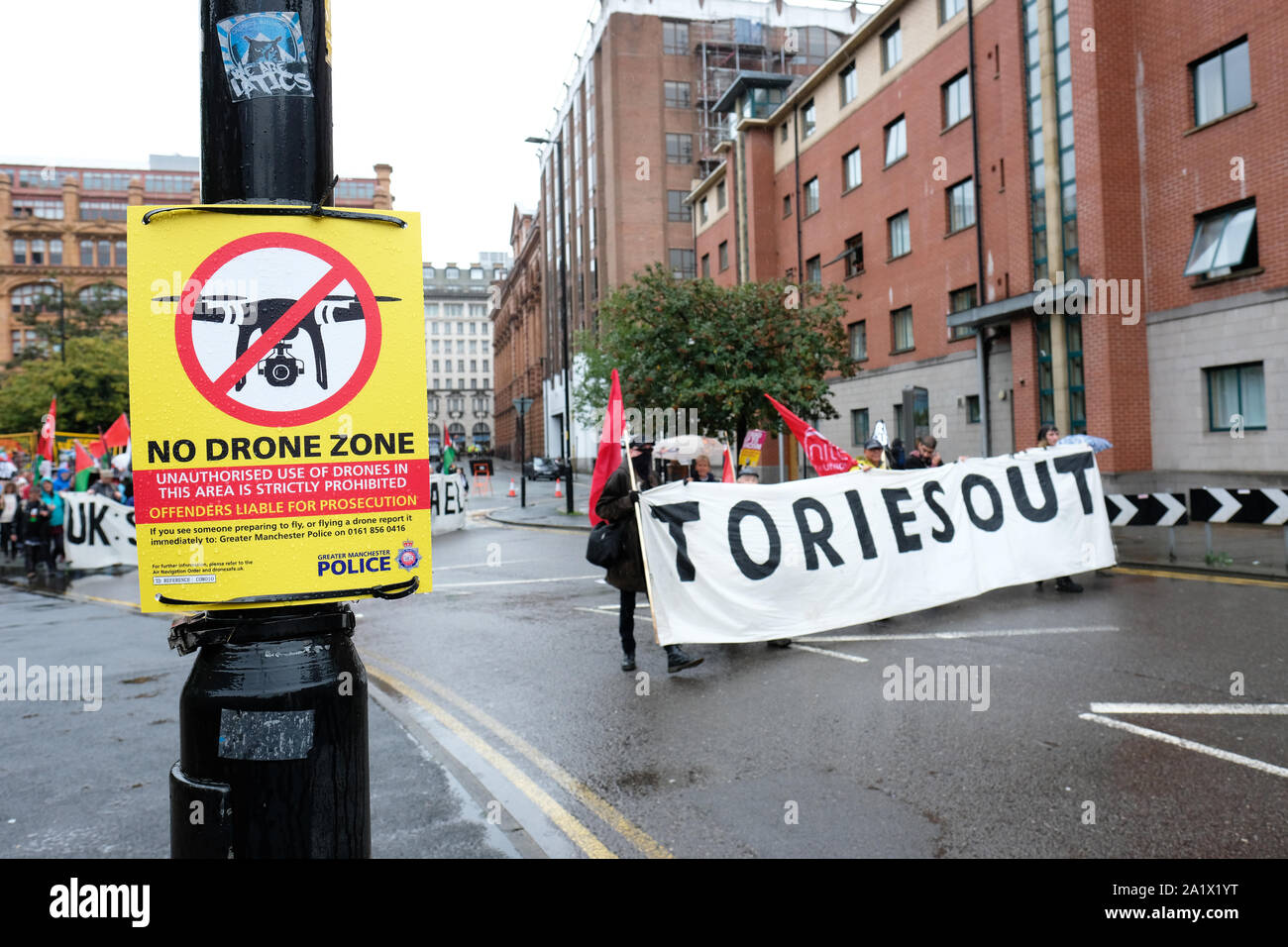 Manchester, UK – Sunday 29th September 2019.  Police anti-drone sign along the route as protesters demonstrate in the rain against Austerity and Brexit in Manchester city centre near the Conservative Party Conference on the opening day of the Tory event.  Photo Steven May / Alamy Live News Stock Photo