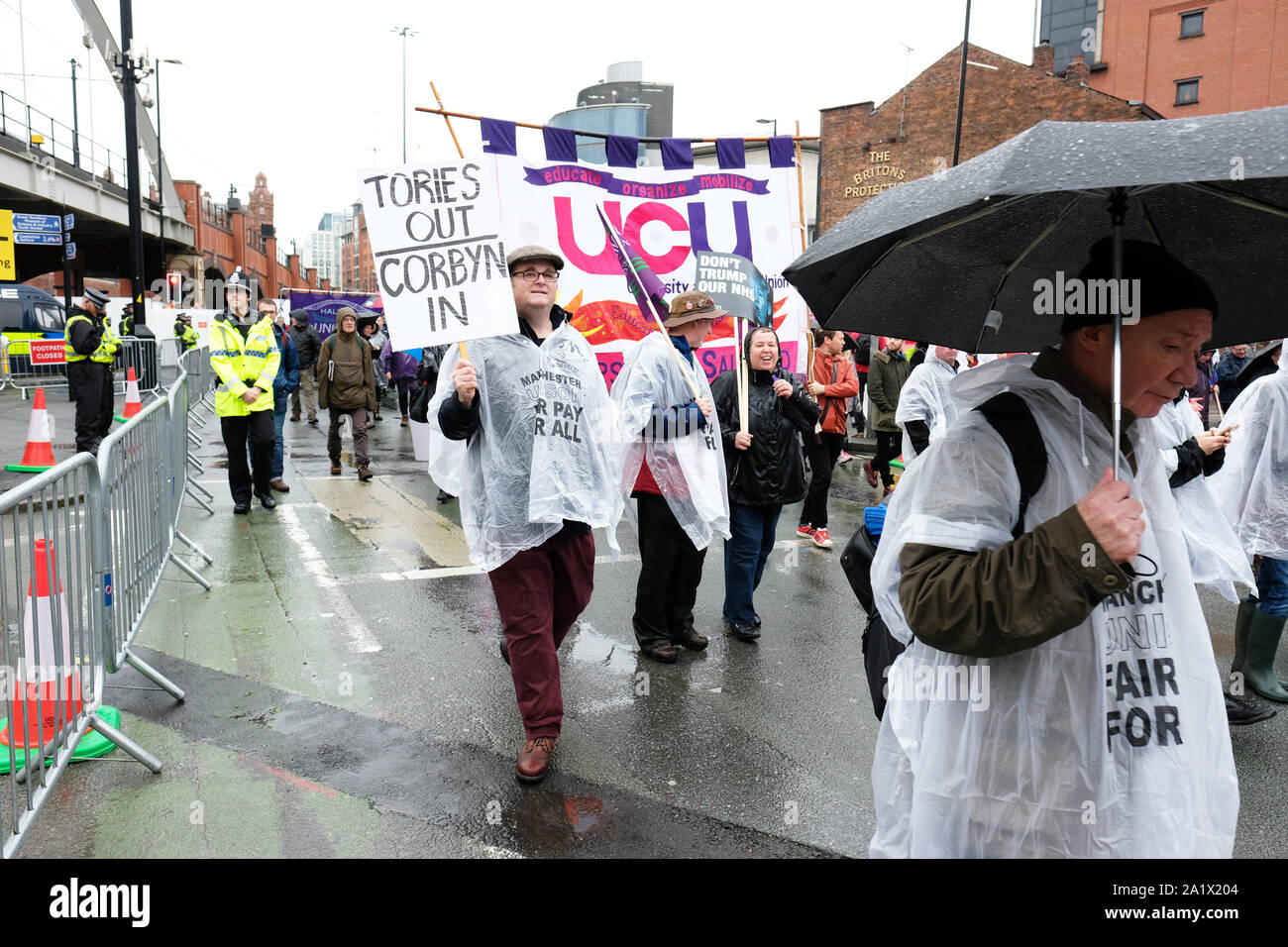 Manchester, UK – Sunday 29th September 2019.  Protesters demonstrate in the rain against Austerity and Brexit in Manchester city centre near the Conservative Party Conference on the opening day of the Tory event.  Photo Steven May / Alamy Live News Stock Photo