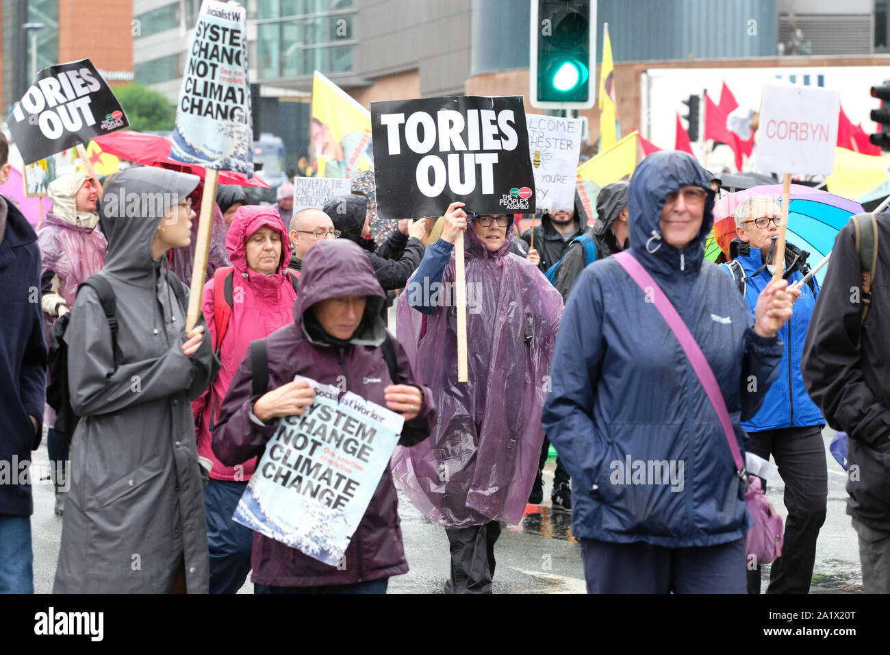 Manchester, UK – Sunday 29th September 2019.  Protesters demonstrate in the rain against Austerity and Brexit in Manchester city centre near the Conservative Party Conference on the opening day of the Tory event.  Photo Steven May / Alamy Live News Stock Photo
