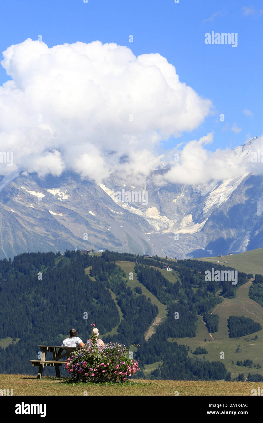 Couple warching the Mont Blanc. Vue du massif du Jaillet. Haute-Savoie. France. Stock Photo