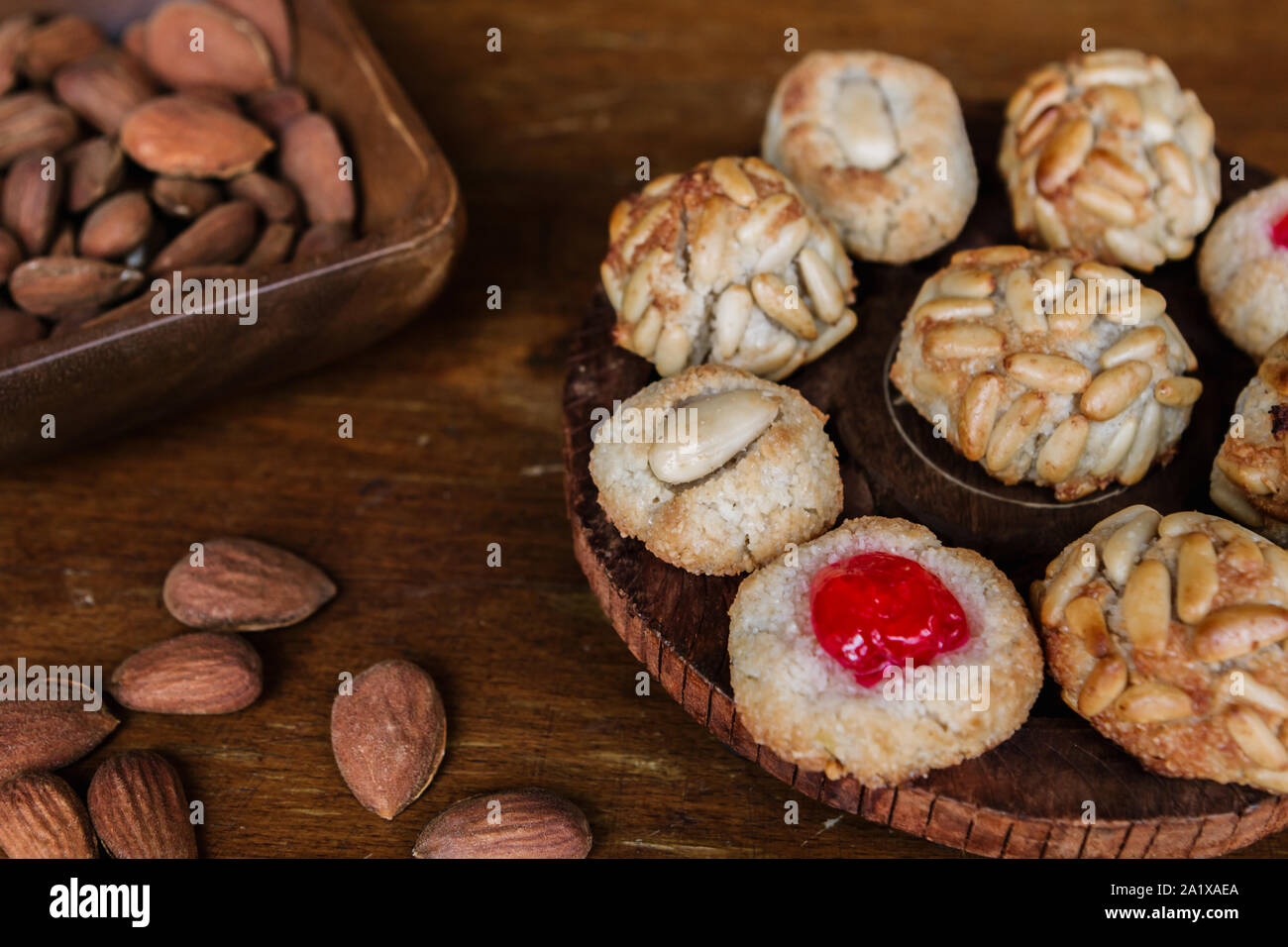 Some typical catalan panellets with some almonds. Typical desert in La Castanyada (Tots Sants) Stock Photo