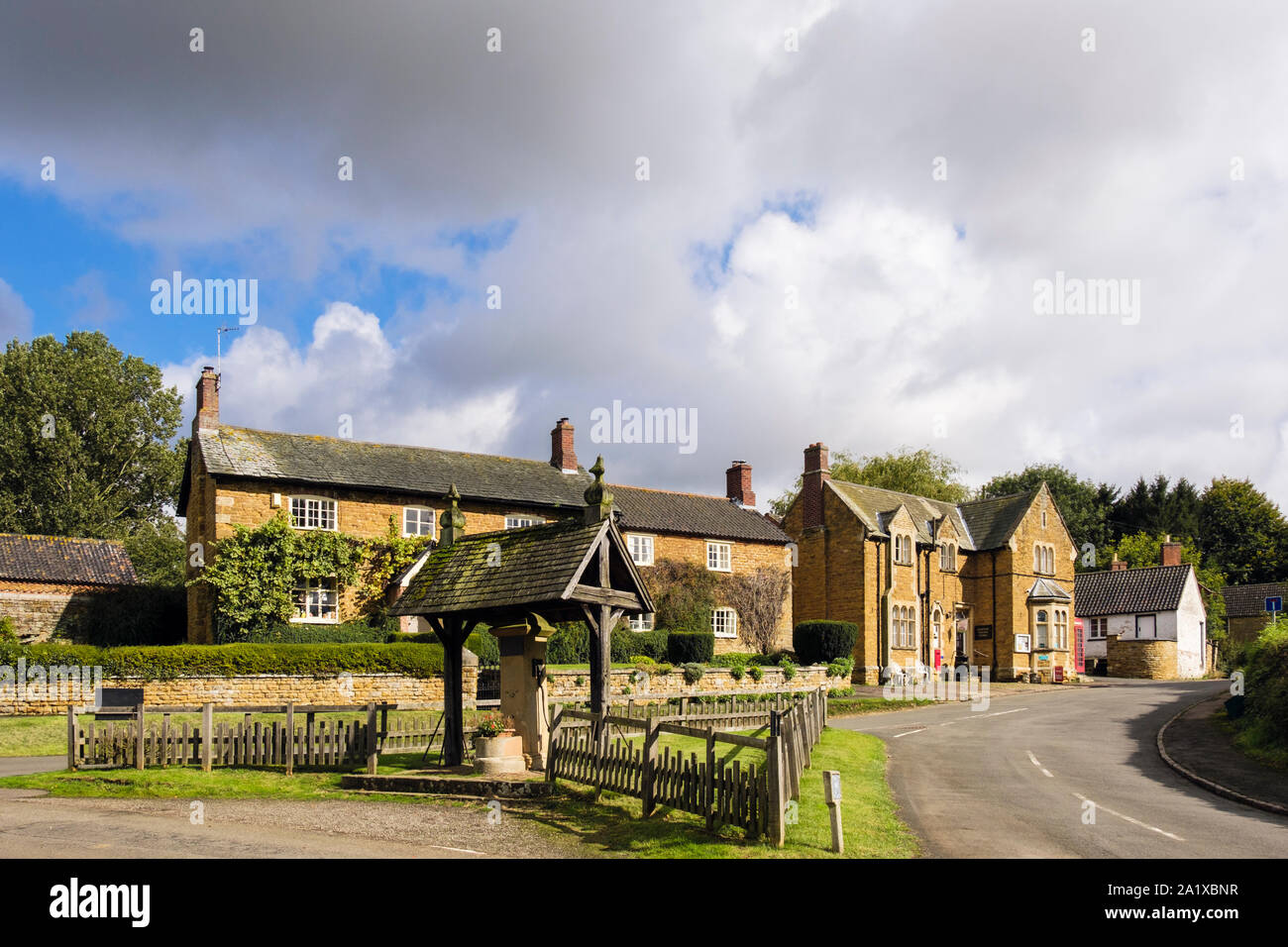 Village green and old pump in centre of Knipton, Vale of Belvoir, Leicestershire, England, UK, Britain Stock Photo