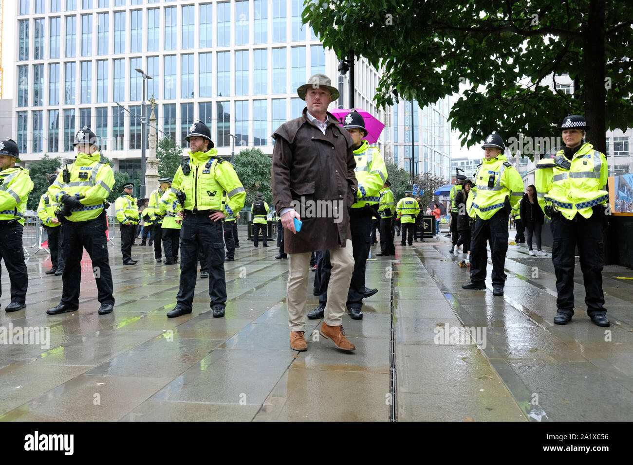 Manchester, UK.  Sunday 29th September 2019.  Delegates arrive in the rain at the Conservative Party Conference on the opening day of the Tory event.  Photo Steven May / Alamy Live News Stock Photo