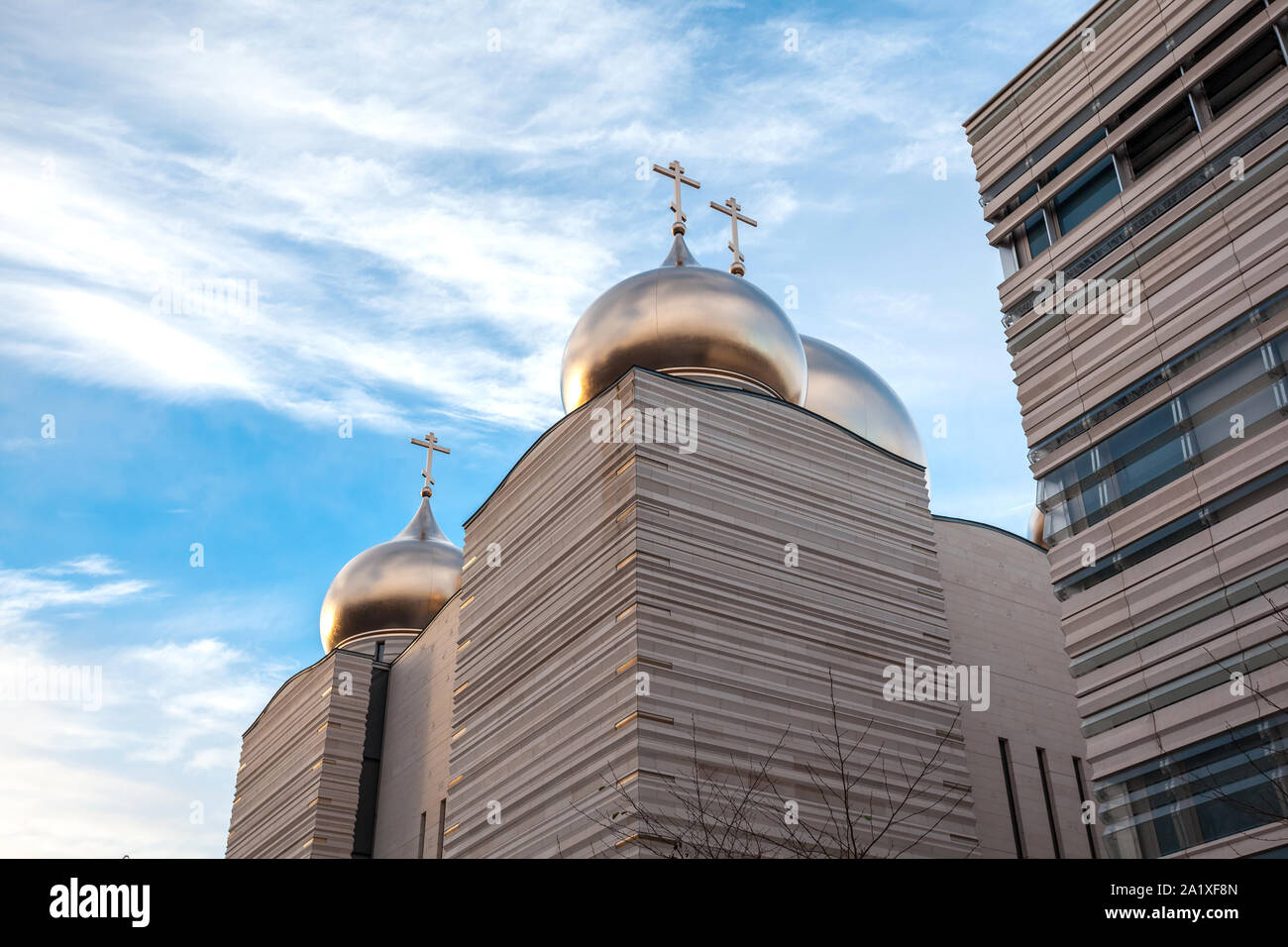 The Holy Trinity Cathedral is an Orthodox cathedral by french architect Jean-Michel Wilmotte, topped by five golden onion domes with orthodox crosses. Stock Photo