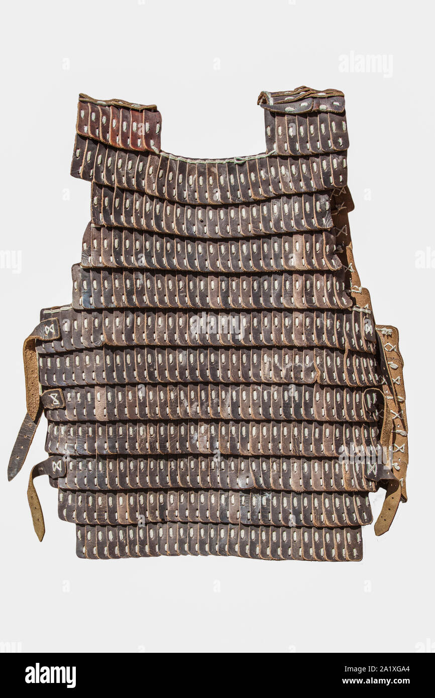 Lamellar armour used by moorish army during Reconquest period. It is made hardened leather of pig. Isolated over white background Stock Photo